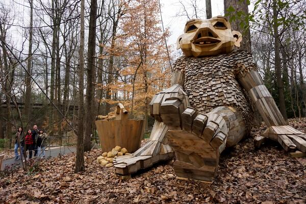 A 12-foot-high troll sits on the ground in Atlanta Botanical Garden’s Storza Woods, part of the new “Trolls: Save the Humans” exhibit. / Courtesy of Atlanta Botanical Garden