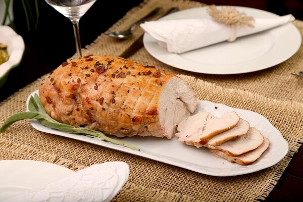 Behold the ideal alternative to the full bird: a boneless turkey breast, roasted with a sage butter rub.  