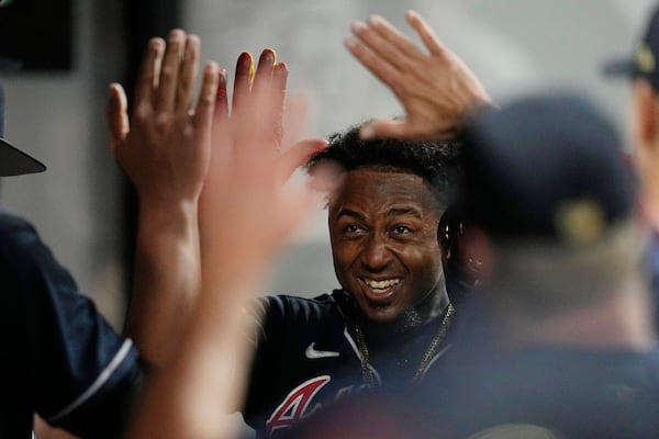 Atlanta Braves' Ozzie Albies celebrates his home run against the Cleveland Guardians during the ninth inning of a baseball game Tuesday, July 4, 2023, in Cleveland. (AP Photo/Sue Ogrocki)