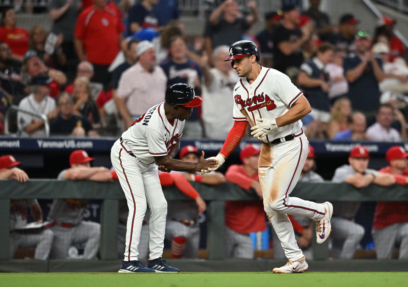 Atlanta Braves' first baseman Matt Olson (28) celebrates with Atlanta Braves' third base coach Ron Washington (37) after hitting a solo home run during the fifth inning at Truist Park, Thursday, September 7, 2023, in Atlanta. Atlanta Braves won 8-5 over St. Louis Cardinals. (Hyosub Shin / Hyosub.Shin@ajc.com)