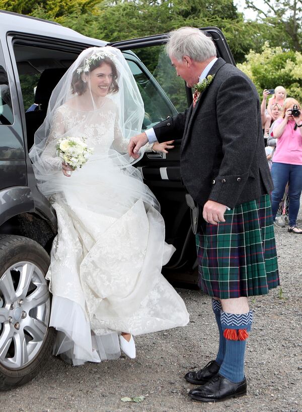 Actress Rose Leslie is escorted by her father Sebastian as they arrive for her wedding at Rayne Church, Kirkton of Rayne in Aberdeenshire, Scotland, Saturday June 23, 2018.