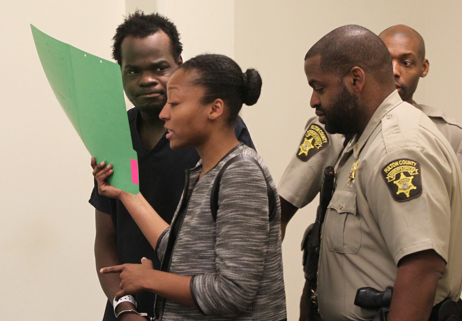 April 1, 2017, Atlanta, Georgia - Basil Eleby is escorted by his public defender and two Fulton County Sheriff's office officers into the court room of presiding Judge James Altman at the Fulton County Jail in Atlanta, Georgia, on April 1, 2017. Eleby received two charges of $100,000 each amounting to total bail of $200,000 for Criminal Damage 1st Degree and Arson 1st Degree after setting a fire underneath a bridge on I-85 NB that would eventually cause a section of the bridge on I-85 to be closed off indefinitely. (HENRY TAYLOR / HENRY.TAYLOR@AJC.COM)