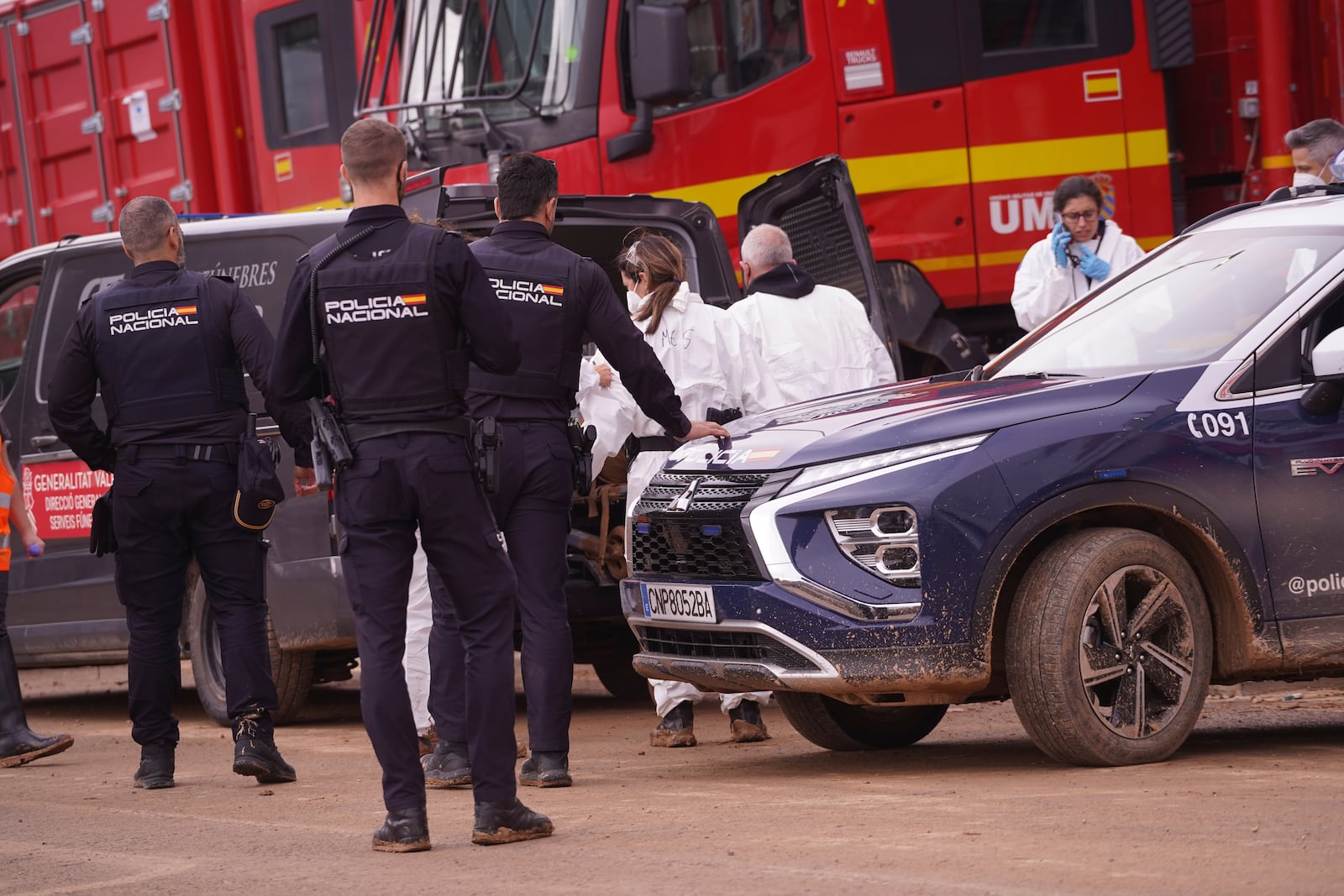 A body found in the MN4 shopping centre on the outskirts of Valencia, Spain is placed in a funeral van after floods in the Valencia area, Monday, Nov. 4, 2024. (AP Photo/Alberto Saiz)