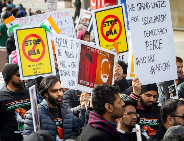 Protesters march along Centennial Olympic Park Drive near CNN Center during the Americans United for Justice in India rally on Sunday, January 26, 2020. STEVE SCHAEFER / SPECIAL TO THE AJC