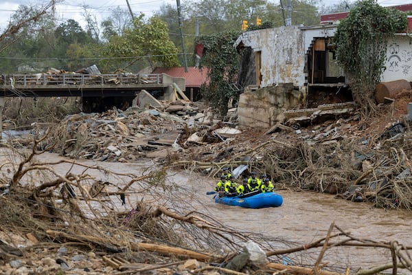 A rescue team paddles down the Swannanoa River two days after Hurricane Helene hit western North Carolina last year.  (Travis Long/The News & Observer/TNS)