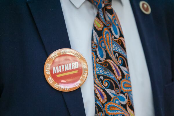 A guest during the celebration commemorating the 50th anniversary of the inauguration of Mayor Maynard Jackson wears a pin on his jacket at the Atlanta City Hall Atrium, Monday, January 8, 2024, in Atlanta. (Jason Getz / Jason.Getz@ajc.com)