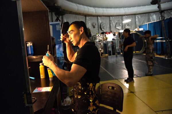 Artists get ready for Cirque du Soleil Volta under the big top tent at Atlantic Station on Thursday, December 12, 2019. Behind-the-scenes of Cirque, with an emphasis on the musicians who are a visible part of the show. The storyline revolves around Waz, a young man in danger of becoming one of the Greys, a group of conforming city dwellers who are glued to their cellphones and locked into boring routines. In a bid for love and attention, Waz becomes enamored with celebrity culture and competes on the Mr. Wow Show. But things end badly when Waz is harshly judged for the thing that makes him special. Thanks to the Freespirits, escaped Greys who enjoy the freedom of being true to themselves, Waz learns to accept himself for who he is. (Hyosub Shin / Hyosub.Shin@ajc.com)