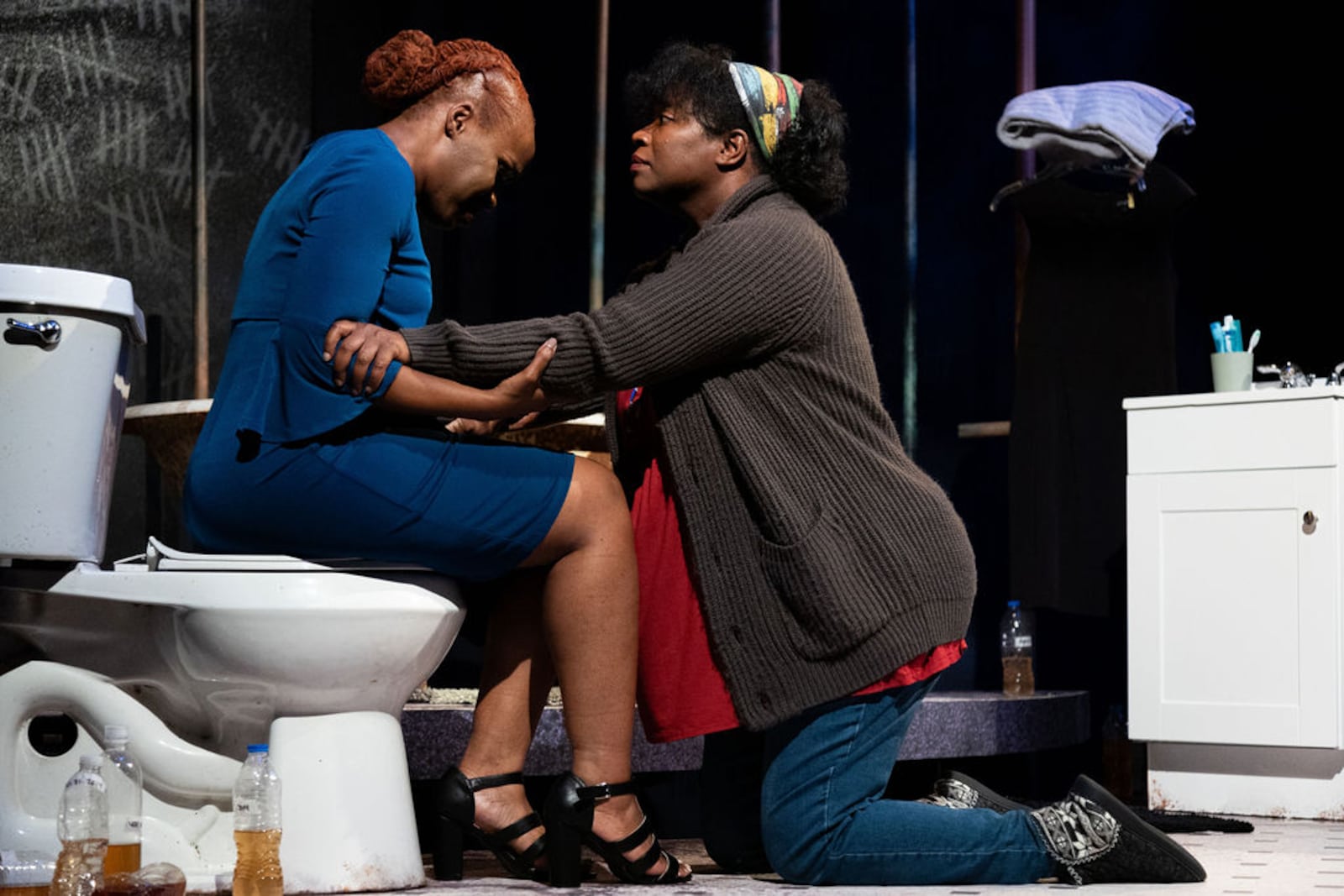 From left, Marion (Marita McKee) and pregnant Ainee (Parris Sarter) are strained by the health and emotional crises of living with contaminated water coming from the taps. Photo: Casey Gardner Ford