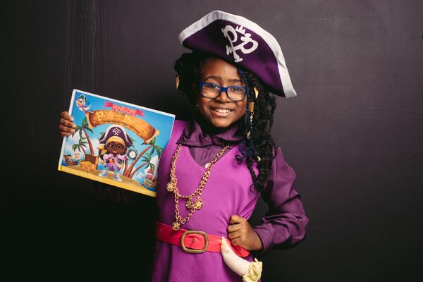 Author and Atlanta Public School third grader Selah Thompson with her first book, “Penelope the Pirate Princess.”