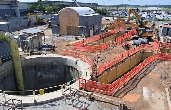 June 9, 2022 Atlanta - Construction view from a cage that is being lifted by a crane to transport crew between the ground and the tunnel under construction beneath Hartsfield-Jackson International on Thursday, June 9, 2022. Sixty feet below the world's busiest airport, crews from the Clark Construction-led joint venture of Clark/Atkinson/Technique have been excavating a 833-foot extension for the Plane Train tunnel.  (Hyosub Shin / Hyosub.Shin@ajc.com)