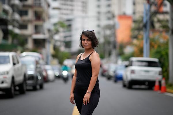 Elham Ghaedi, a migrant from Iran, poses for a portrait in Panama City, Monday, March 10, 2025, after being deported from the United States, detained for weeks in a Panamanian immigration camp, and released on a temporary humanitarian visa allowing a 30‑day stay. (AP Photo/Matias Delacroix)