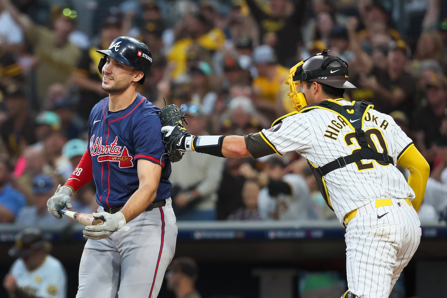 Atlanta Braves’ Matt Olson (28) strikes out and tagged by San Diego Padres catcher Kyle Higashioka (20) during the third inning of National League Division Series Wild Card Game One at Petco Park in San Diego on Tuesday, Oct. 1, 2024.   (Jason Getz / Jason.Getz@ajc.com)