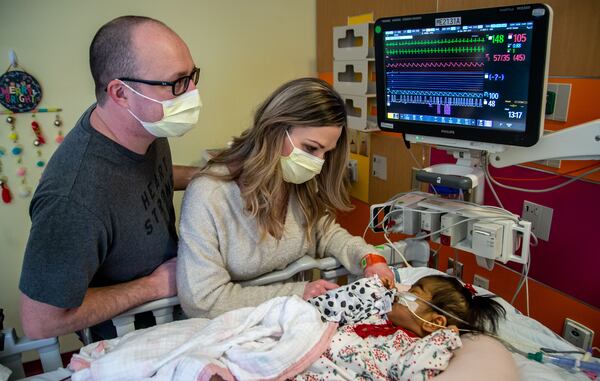 Tamara and Justin Harris take turns sitting for 24-shifts in the ICU with Rynli while the spouse stays with their older children. STEVE SCHAEFER FOR THE ATLANTA JOURNAL-CONSTITUTION