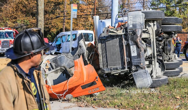 Five people were injured Monday in a crash involving a tractor-trailer and a van, authorities said. JOHN SPINK / JSPINK@AJC.COM