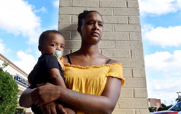 Lanette Jones holds her son, who was born in February while her husband Maurice Franklin was behind bars in a gang case. (RYON HORNE/RHORNE@AJC.COM)