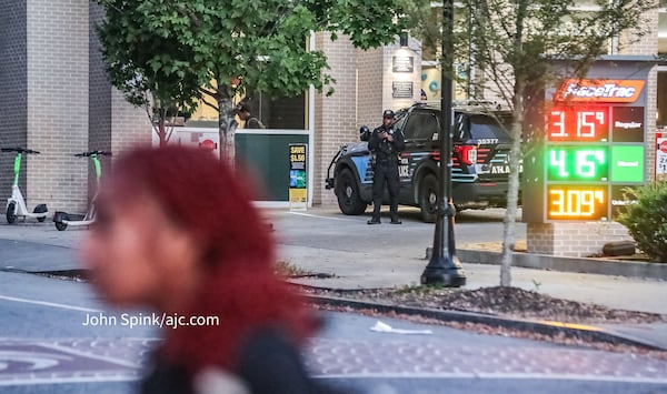 An Atlanta police officer is seen Monday near Georgia State University. President M. Brian Blake said officers would be increasing patrols in the area after a shooting near campus early Sunday, Oct. 29, 2023. (John Spink / John.Spink@ajc.com)