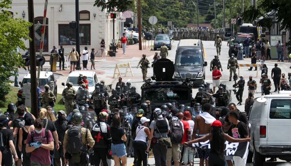 8/15/20 - Stone Mountain, GA - Police begin to move in as several far-right groups, including militias and white supremacists, rally Saturday in the town of Stone Mountain, and a broad coalition of leftist anti-racist groups organized a counter-demonstration there after local authorities closed Stone Mountain park.   Alyssa Pointer / alyssa.pointer@ajc.com