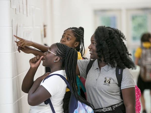 August 1, 2019, 2019 - McDonough - Students check class listings as the school day begins.  Henry County students have their first day of school at the brand new McDonough Middle School. Thursday was the first day of school of the 2019-2020 school year.  Bob Andres / robert.andres@ajc.com