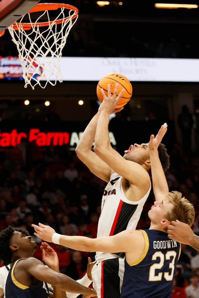 Bulldogs guard Jabri Abdur-Rahim attempts a shot against Fighting Irish guard Dane Goodwin during the second half Sunday night at State Farm Arena. (Miguel Martinez / miguel.martinezjimenez@ajc.com)