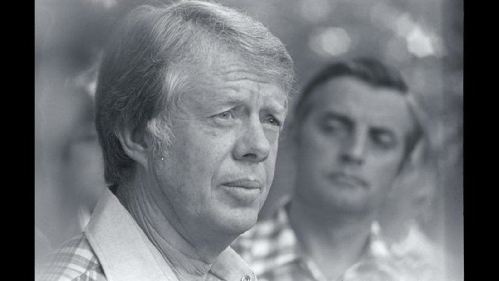  Walter Mondale (right) listens while his running mate, Jimmy       Carter, talks to reporters during their campaign for the 1976       presidential election. (Photo by Owen Franken/Corbis via Getty       Images)