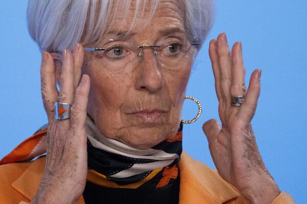 European Central Bank (ECB) President Christine Lagarde adjusts her spectacles at the bank's post-meeting news conference, in Frankfurt, Thursday, March 6, 2025. (Boris Roessler/dpa/dpa via AP)