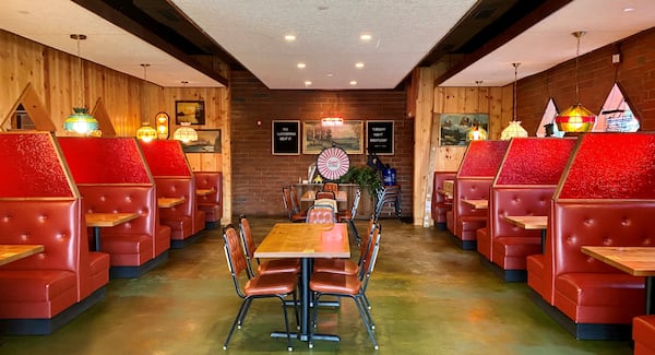 The owners of LLoyd’s have added red fake-glass dividers between the booths of the main dining room — appropriate to both the retro-tacky design and the era of COVID-19. Wendell Brock for The Atlanta Journal-Constitution