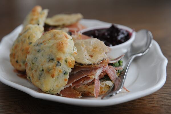 151030-ATLANTA-GA- Wyatt Williams dine review of Southern Gentleman in Cheddar herb biscuits and ham with fried pickles and seasonal Jam. (BECKY STEIN PHOTOGRAPHY.COM)