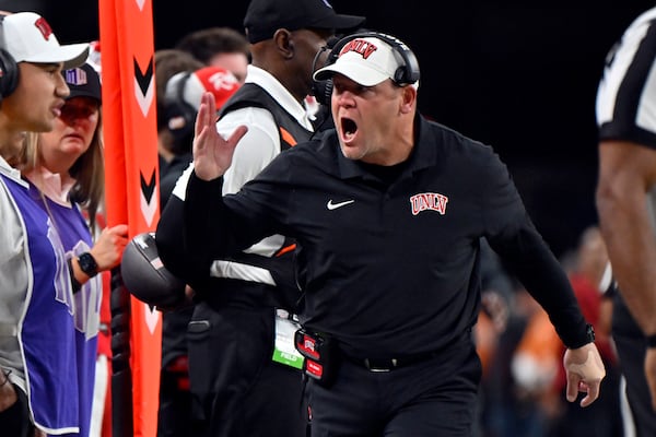 UNLV head coach Barry Odom calls to his team during the first half of an NCAA college football game against Nevada, Saturday, Nov. 30, 2024, in Las Vegas. (AP Photo/David Becker)