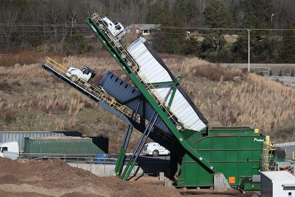 012821 Carnesville: A pair of 25-plus ton big rig trucks are off loaded on truck tippers by the fuel yard at the Georgia Renewable Power, Biomass facility on Thursday, Jan. 28, 2021, in Carnesville.    Curtis Compton / Curtis.Compton@ajc.com”