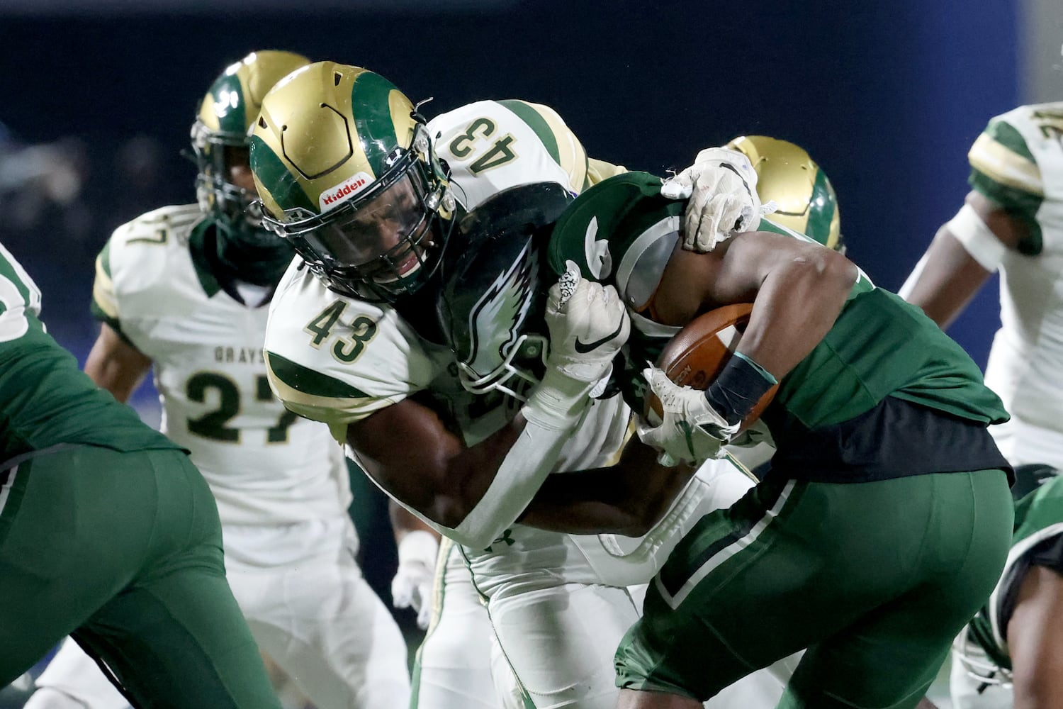 Dec. 30, 2020 - Atlanta, Ga: Collins Hill running back Spenser Anderson (26) is tackled by Grayson defensive lineman Noah Collins (43) during the first half of their Class 7A state high school football final at Center Parc Stadium Wednesday, December 30, 2020 in Atlanta. JASON GETZ FOR THE ATLANTA JOURNAL-CONSTITUTION