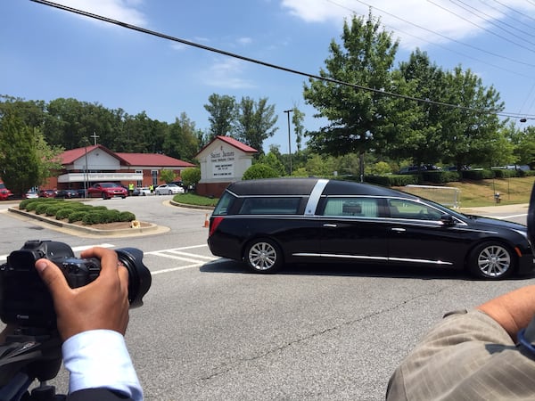 Bobbi Kristina's hearse pulling out of St. James United Methodist Church at about 2 p.m. Saturday, August 1, 2015. CREDIT: Rodney Ho/rho@ajc.com