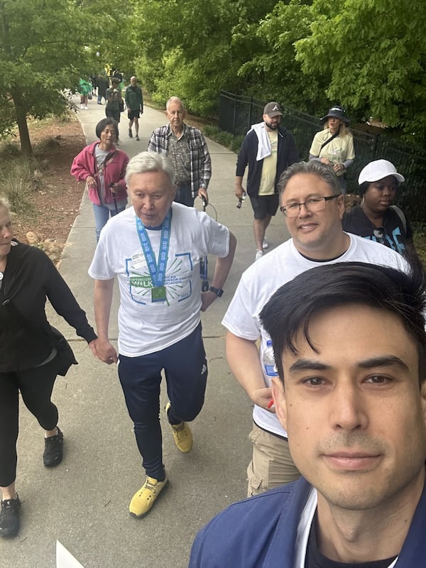 Paul Tom, center, with walking team at the APDA Georgia Optimism Walk 2024. From left, Lorie Coats, Paul Tom, James Tom, and Colin Tom. (Photo by Colin Tom)