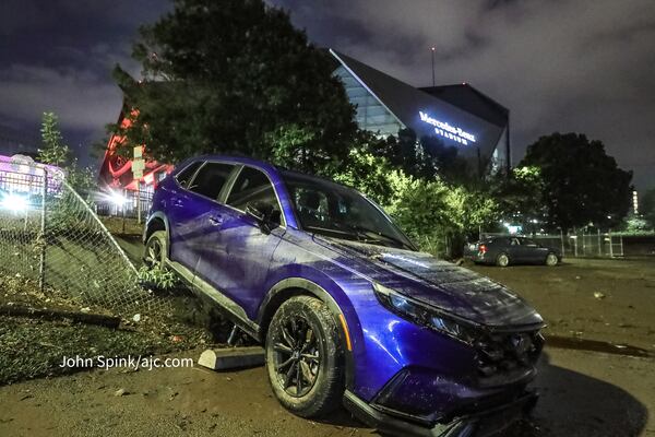 Cars were swept away amid rushing floodwater in Downtown Atlanta on Sept. 14, 2023.