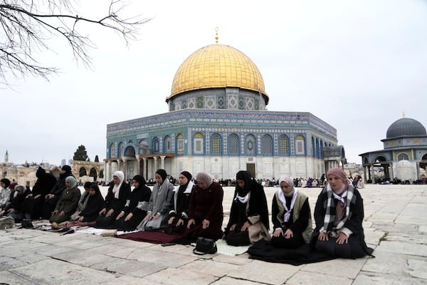 Worshippers beside the Dome of the Rock Mosque at the Al-Aqsa Mosque compound take part in the first Friday Prayers of the Muslim holy month of Ramadan in the Old City of Jerusalem, Friday, March 7, 2025. (AP Photo/Mahmoud Illean)