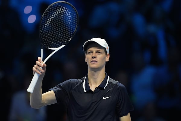 Italy's Jannik Sinner celebrates after winning the singles tennis match of the ATP World Tour Finals against Australia's Alex de Minaur, at the Inalpi Arena, in Turin, Italy, Sunday, Nov. 10, 2024. (AP Photo/Antonio Calanni)