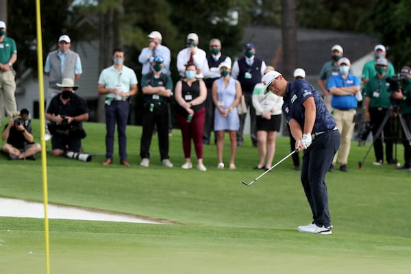 Sungjae Im hits on the 18th green during the final round of the Masters Tournament Sunday, Nov. 15, 2020, at Augusta National. (Curtis Compton / Curtis.Compton@ajc.com)