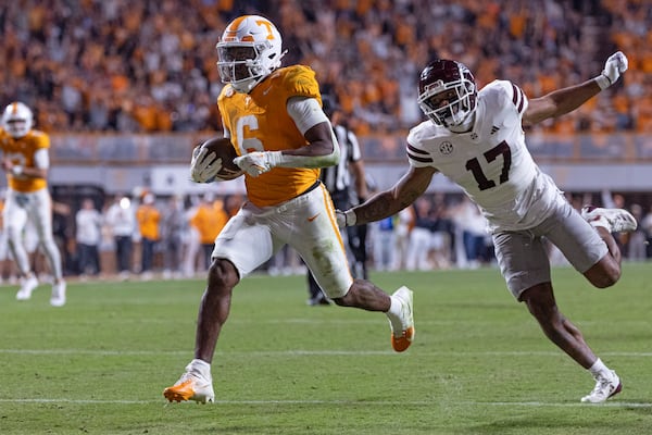 Tennessee running back Dylan Sampson (6) outruns Mississippi State safety Jordan Morant (17) for a touchdown during the second half of an NCAA college football game Saturday, Nov. 9, 2024, in Knoxville, Tenn. (AP Photo/Wade Payne)