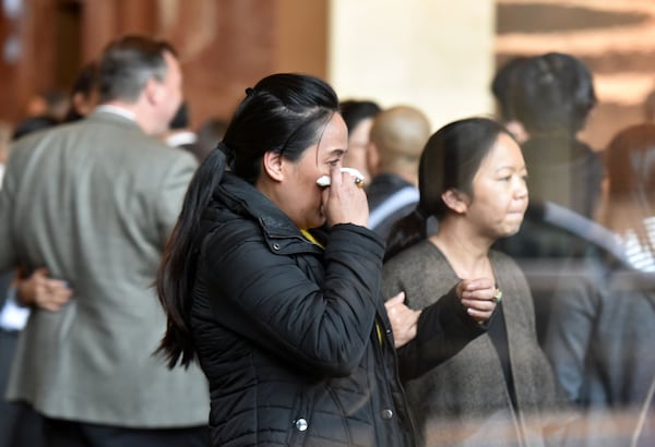 Although there were smiles and moments of levity during the Atlanta candlelight vigil honoring Trinh Huynh on Thursday, April 6, some mourners couldn’t keep their tears from flowing. Huynh was fatally shot Monday morning in Midtown Atlanta. HYOSUB SHIN / HSHIN@AJC.COM