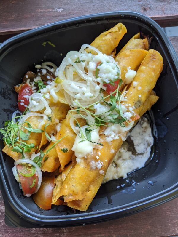 Roasted mushroom flautas from Alma Cocina are garnished with cashew crema, pico de gallo and huitlacoche sauce. Courtesy of Paula Pontes