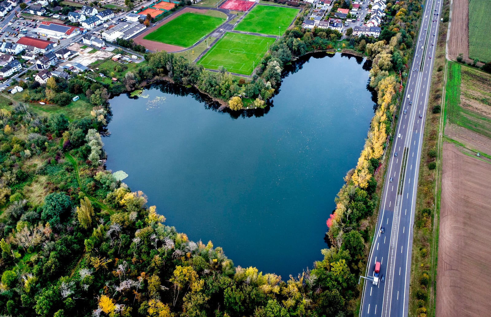 FILE - A lake in the shape of a heart is visible in Rodgau, near Frankfurt, Germany, Saturday, Oct. 12, 2024. (AP Photo/Michael Probst, File)