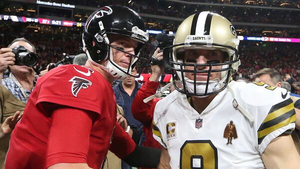 Atlanta Falcons quarterback Matt Ryan (2) speaks with New Orleans Saints quarterback Drew Brees (9) after an NFL football game, Thursday, Dec. 7, 2017, in Atlanta. The Falcons won 20-17.(AP Photo/John Bazemore)