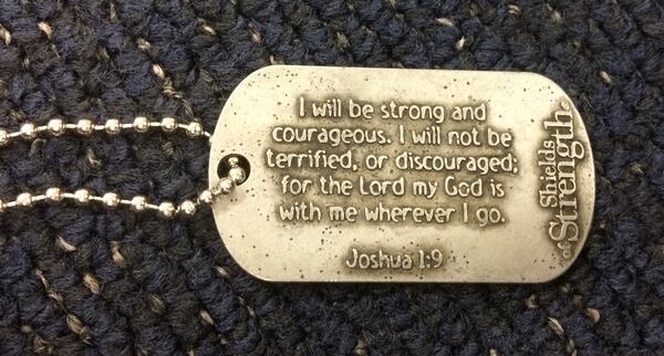 Rev. Shirley Petty keeps a supply of prayer pendants in the shape of dog tags, to hand out to travelers military and otherwise. Photo: Jennifer Brett