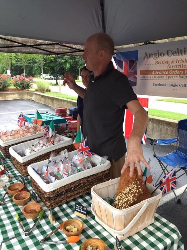 Pete Halpin, the English-born baker of Anglo Celtic Bakes, presides over a table full of British-Irish treats — like scones, hobnob cookies and soda bread — at his Brookhaven Farmers Market booth. CONTRIBUTED BY BROOKHAVEN FARMERS MARKET