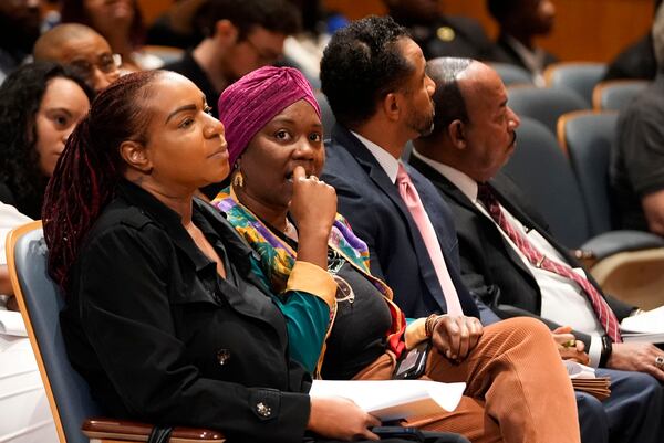 Candice Henderson-Chandler, second left, property owner of the home of former civil rights leader Oretha Castle Haley, listens during a city council hearing regarding her plans to open a museum, opposed by Oretha Castle Haley's family, in New Orleans, Thursday, Oct. 24, 2024. (AP Photo/Gerald Herbert)