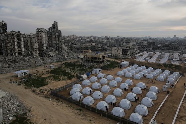 A tent camp for displaced Palestinians is set up amid destroyed buildings in the west of Al-Shati camp, west of Gaza City, on Monday, March 3, 2025. (AP Photo/Jehad Alshrafi)