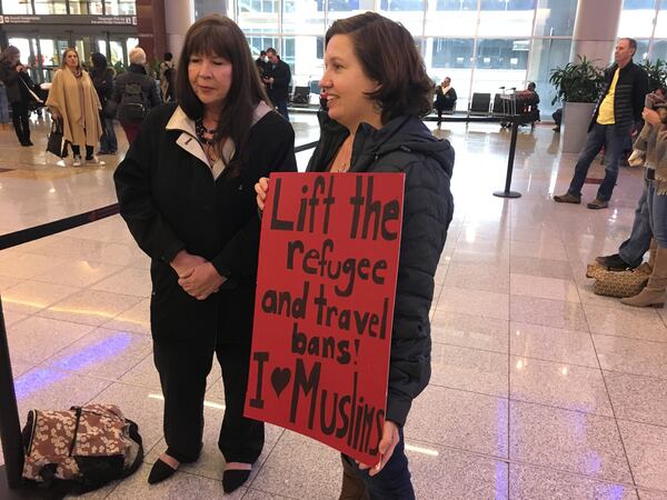 Jan. 29, 2017 Janice Wardlaw (left) and Mary Hoyt (right) arrived at Atlanta Hartsfield-Jackson Airport on Sunday to protest the Trump administration's executive order banning refugees from the country. RHONDA COOK / rcook@ajc.com