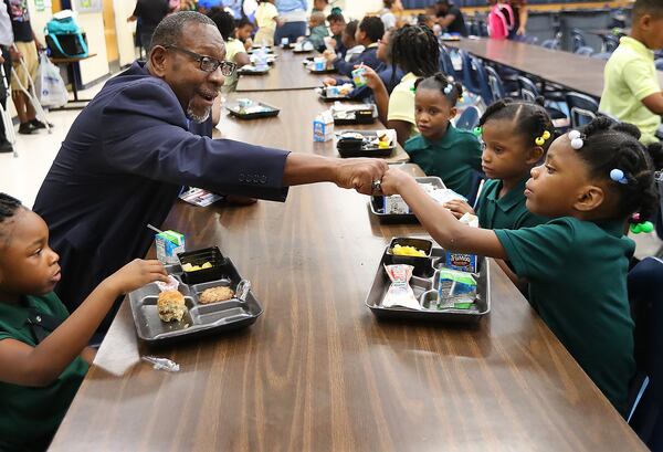 DeKalb School Superintendent Steve Green gives 6-year-old kindergarten student Lanyah Bailey a fist bump during the first day of school at Edward L Bouie Elementary School on Monday, August 7, 2017, in Lithonia. Curtis Compton/ccompton@ajc.com