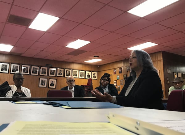 Atlanta Federation of Teachers president Verdaillia Turner, right, speaks during a Feb. 28 news conference about the group's opposition to an Atlanta Public Schools improvement plan. VANESSA McCRAY/AJC