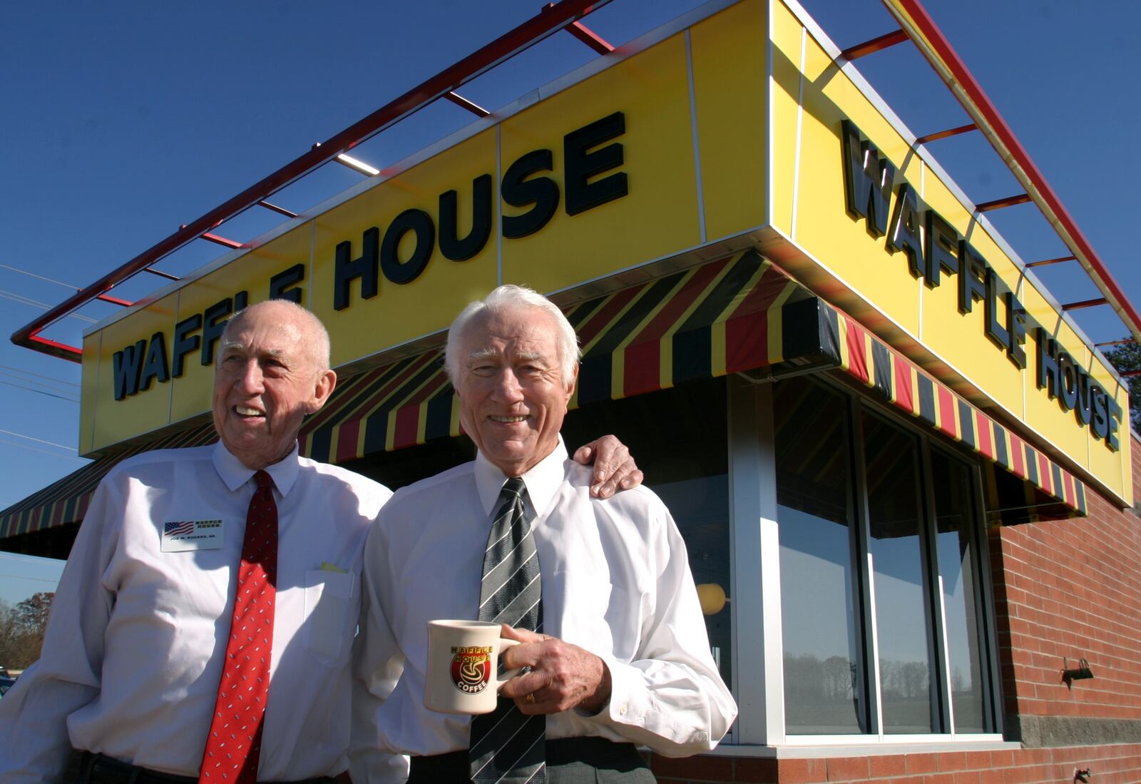 Joe Rogers Sr. (left) and Tom Forkner, who started the Waffle House chain 50 years ago, relinquished most operational control to Joe Rogers Jr. in 1973. / JESSICA MCGOWAN / Special