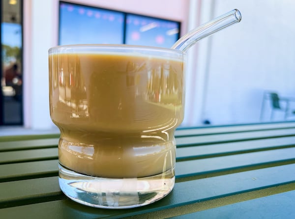 If you can't enjoy the nitrogen-infused version of Valor's Lavender Vanilla Latte pictured here, make it hot or iced at home with your favorite milk. (Henri Hollis / AJC)